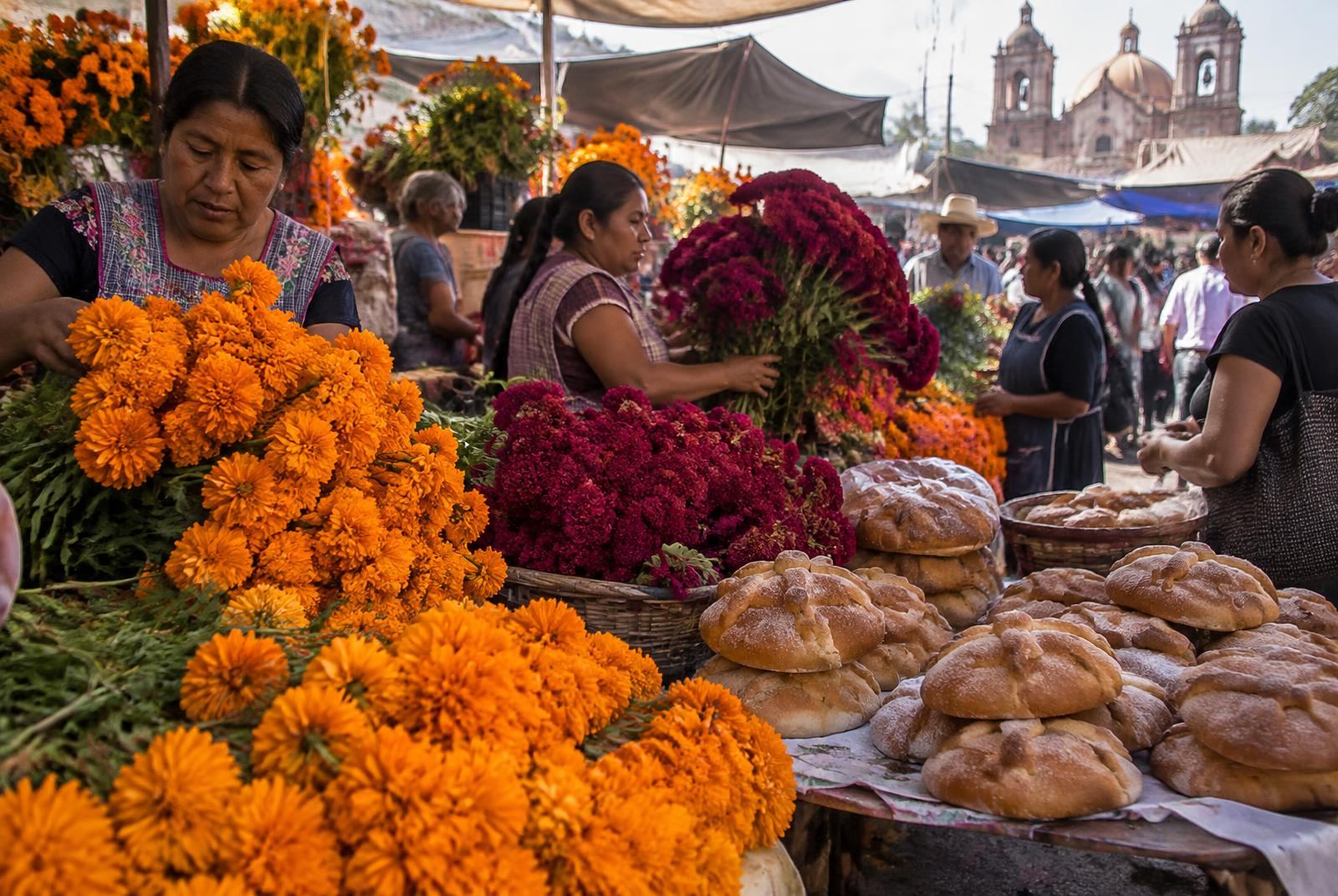 Marigolds, cockscomb and pan de muerto in an Oaxaca valley market in the days before the celebration.