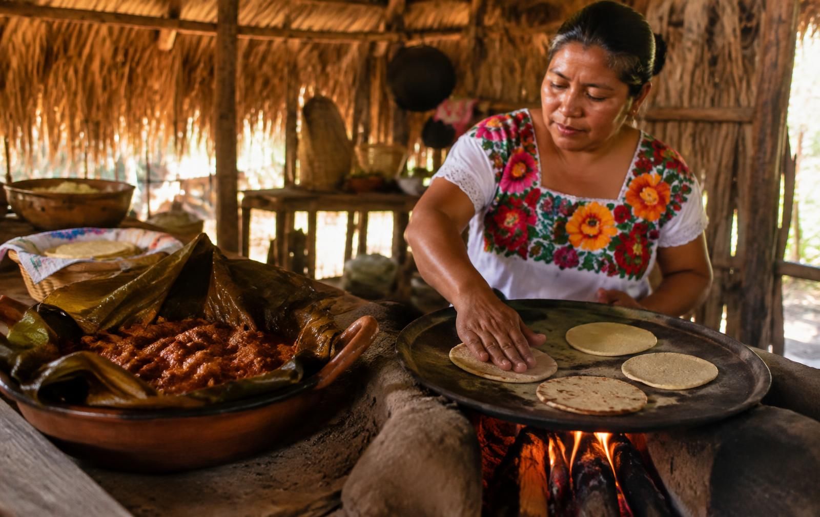 Cook with a Maya family in a nearby village.